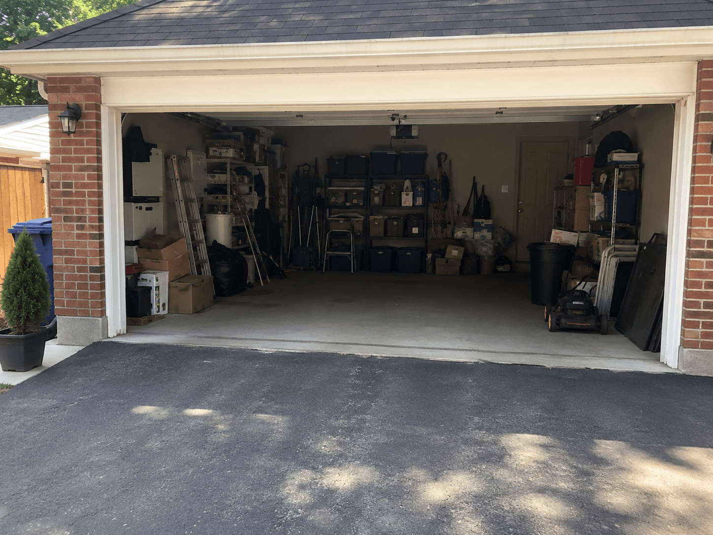 Wide garage photo showing the full scope of the clean-out.